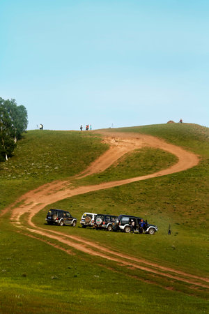 People and cars at a hillの写真素材