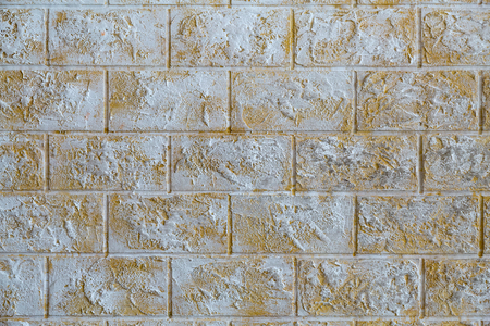 The wall of the house of white and brown stoneの写真素材