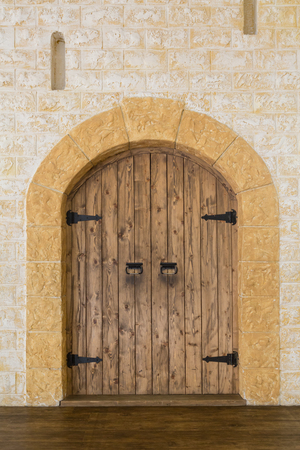 Wooden door in a stone castleの写真素材