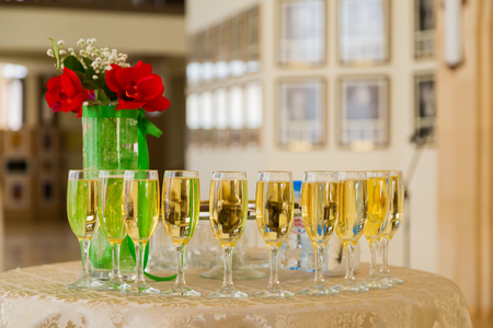 Champagne at the cocktail party. People in the background. Blurred background. Bokeh.の写真素材