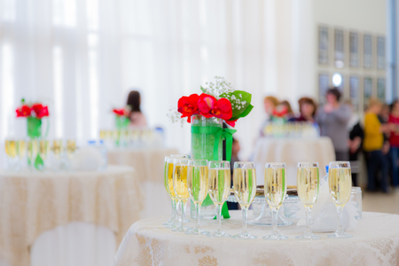 Champagne at the cocktail party. People in the background. Blurred background. Bokeh.の写真素材