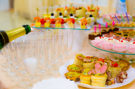 Delicacies and snacks in the buffet. Champagne. Seafood. A gala reception. Banquet. Catering.の写真素材
