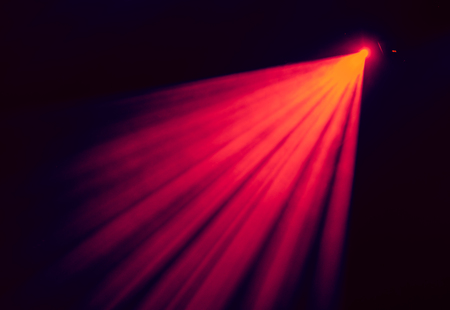 The red light from the spotlights through the smoke at the theater during the performance. Lighting equipment.の写真素材