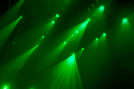 The green light from the spotlights through the smoke in the theatre during the performance. Lighting equipment.の写真素材
