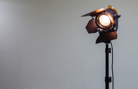 Spotlight with halogen bulb and Fresnel lens. Lighting equipment for Studio photography or videographyの写真素材