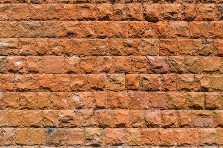 A wall of red stone. Textured background.の写真素材