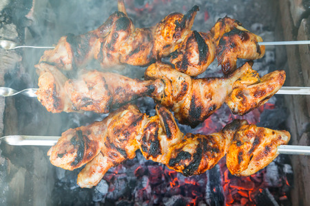 Chicken shish kebab roasting on the coals.の写真素材