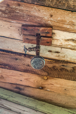 Shower in an old wooden barn in the country.の写真素材
