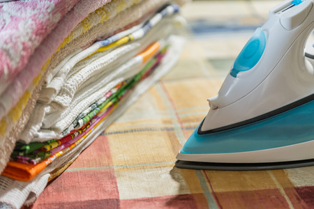 Electric iron for Ironing. Ironing room. Household itemsの写真素材