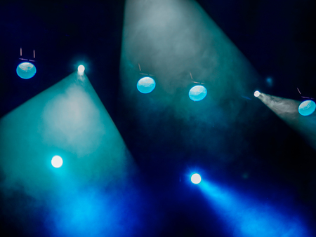 Lighting equipment on the stage. The spotlight through the smoke. Theater performance.の写真素材