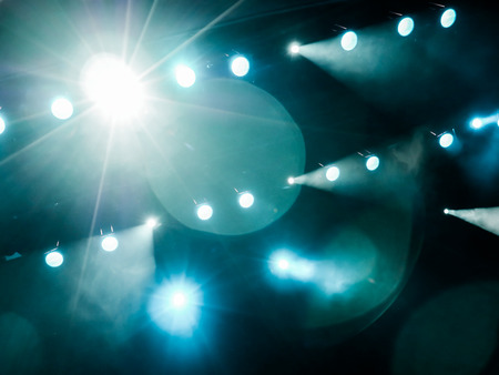 Lighting equipment on the stage. The spotlight through the smoke. Theater performance.の写真素材