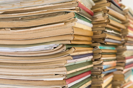 A stack of old school notebooks. Multicolored cover.の写真素材