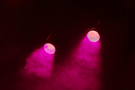Rays theatrical spotlights on the stage during the performance. Lighting equipment. The lighting designer. Theatrical smoke. The art and creativity.の写真素材
