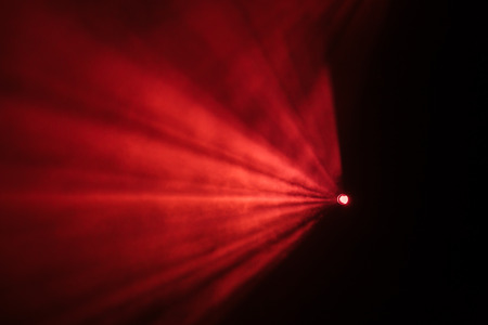 Rays theatrical spotlights on the stage during the performance. Lighting equipment. The lighting designer. Theatrical smoke. The art and creativity.の写真素材