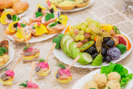 Fruit and snacks on the buffet. Banquets, catering.の写真素材