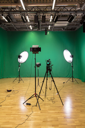 Studio for filming on a green background. The chroma key. Lighting equipment in the Studio. Green screenの写真素材