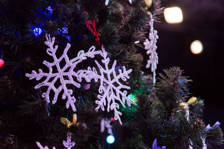 Decorated Christmas tree. Toys and lace snowflakes. New year.の写真素材
