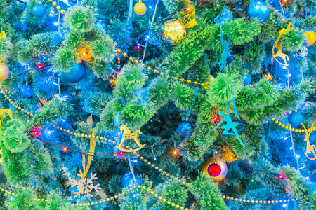 Decorated Christmas tree. Colorful garlands and toys. New year's holiday.の写真素材
