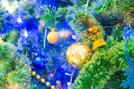 Decorated Christmas tree. Colorful garlands and toys. New year's holiday.の写真素材