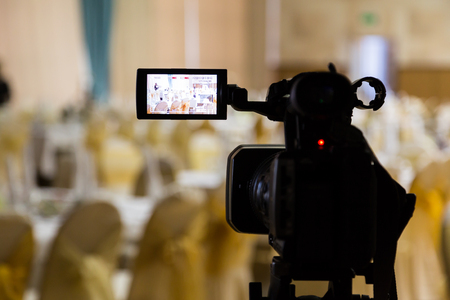 Filming of the event. Videography. Served tables in the Banquet hall.の写真素材