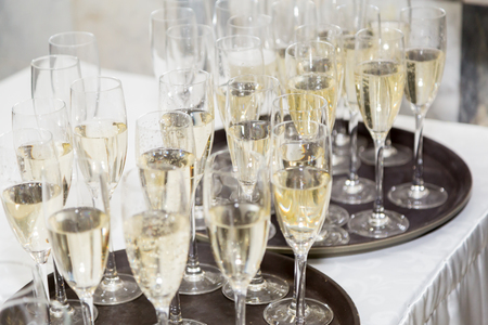 Champagne is poured by the glass. Gala reception or weddingの写真素材