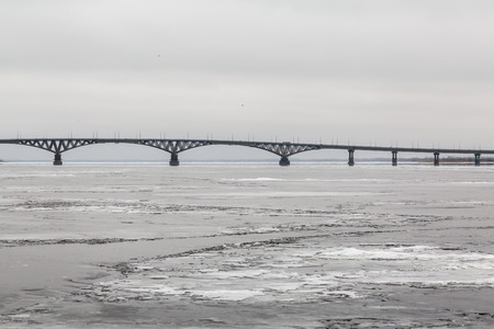 Bridge across the Volga river between the cities of Saratov and Engels. Ice on the river. Russiaの写真素材