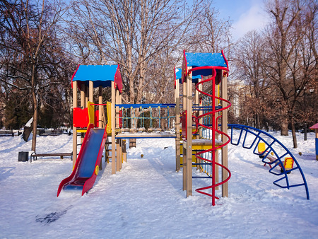 Children's Playground in the city Park. Sunny winter's day.の写真素材