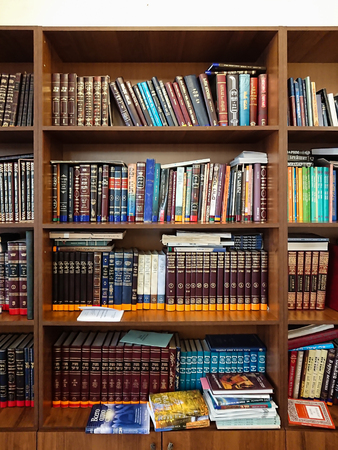 Saratov / Russia - February 25, 2018: Library in the synagogue. Multi-colored books on the bookshelf in the libraryのeditorial素材