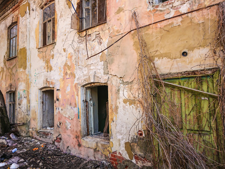 Destroyed house after a fire. Old brick building with Windows.のeditorial素材