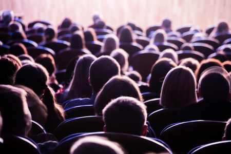 Spectators in the theater or in the cinema. Children and adults. Full house.の写真素材