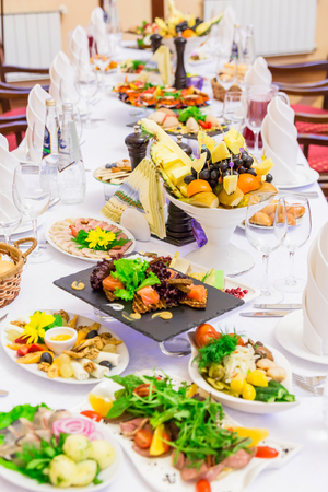 Delicacies, snacks and fruit on the restaurant table. Celebration. Catering Banquet table.の写真素材