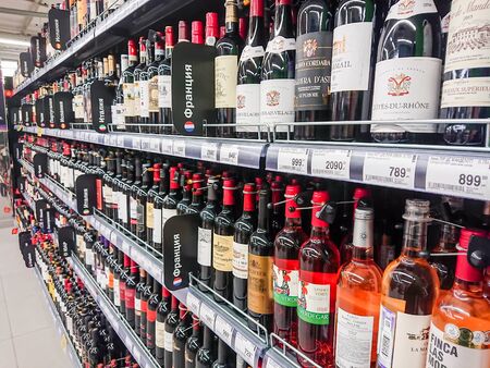 Saratov / Russia - February 5, 2019: Various brands of red and pink wine on the shelves of the supermarket.のeditorial素材