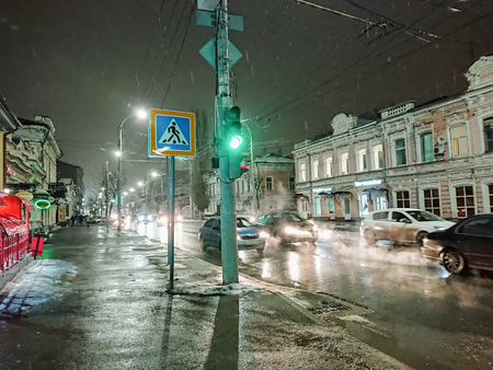 Evening cityscape in rainy weather. Cars and night lights. City of Saratov, Russia.の写真素材