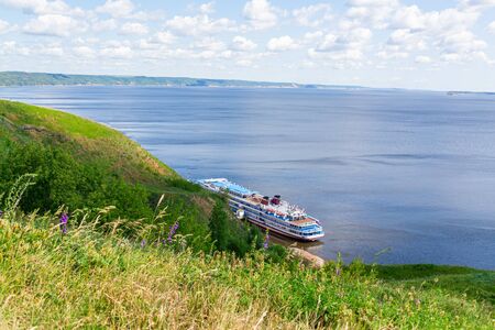 Picturesque river landscape. Four-deck cruise ship at the pier. The view from the top. Volga River, Russia, Tatarstan.の写真素材