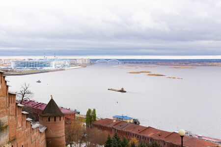 View of the Volga river and the Oka river from the embankment of Nizhny Novgorod. The walls of the stone Kremlin. Autumn cloudy day.の写真素材