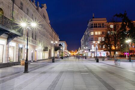 Nizhny Novgorod / Russia - October 16, 2019: Bolshaya Pokrovskaya street. The light of the street lamps. City at dusk. Evening cityscape. Long exposure.のeditorial素材