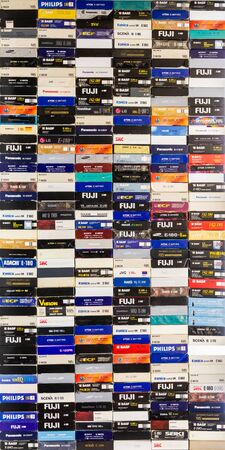 Saratov / Russia - February 15, 2020: A stack of videotapes in VHS format. Colorful boxes of cassettes.のeditorial素材