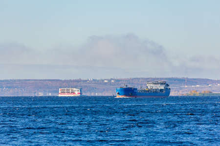 Saratov, Russia - October 21, 2020: The chemical tanker "Glard-1" and the cruise ship "Mustai Karim" of the PV300 project of the Vodohod company on the Volga River. Sunny autumn dayのeditorial素材