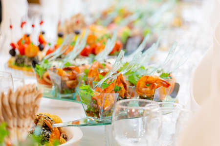 Buffet with meat, fish and vegetable delicacies snacks. restaurant business. Catering.の写真素材