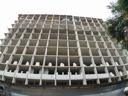 Construction of a multi-storey building made of concrete blocks and bricks.の写真素材
