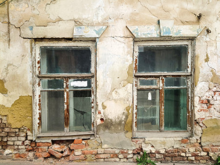 Windows in an old crumbling house.の写真素材