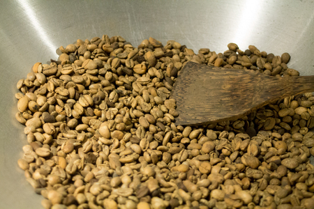 green coffee beans of Java in metal bowl.のeditorial素材