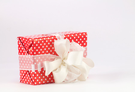 gift box packaging with polka dots and big bowの写真素材