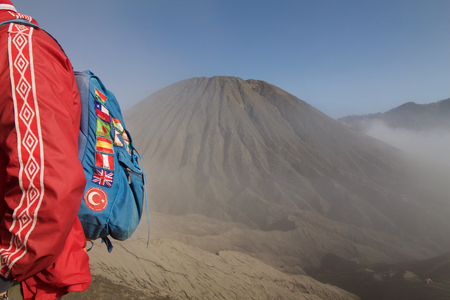 globe trotter backpacker near batok volcano, Java islandの写真素材