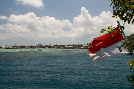 Karimunjawa harbor, flag of Indonesiaの写真素材