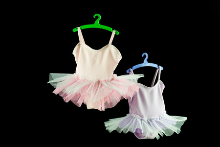 pink and lilac tutu for baby on black backgroundの写真素材