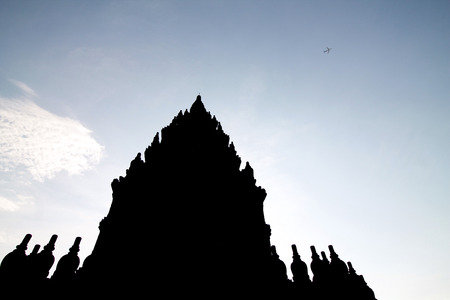 silhouette of part of prambanan temple on blue sky, Central Javaの写真素材