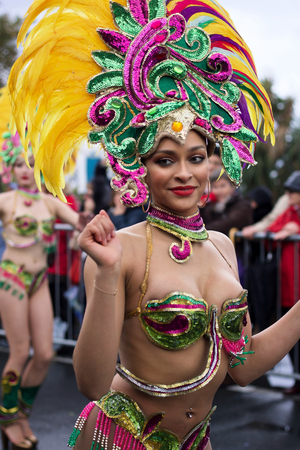 ITALY, SANREMO - march 11, 2018 :beautiful brazilian woman in multicolored costume dancing along the...
