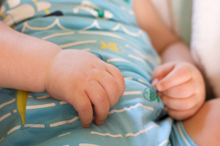 close up of baby boy hand selective focus sleeping relaxedの写真素材