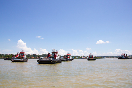 BERAU - KALIMANTAN - August, 29 2018: on large canal waiting for cargo in a beautiful sunny day of summerのeditorial素材